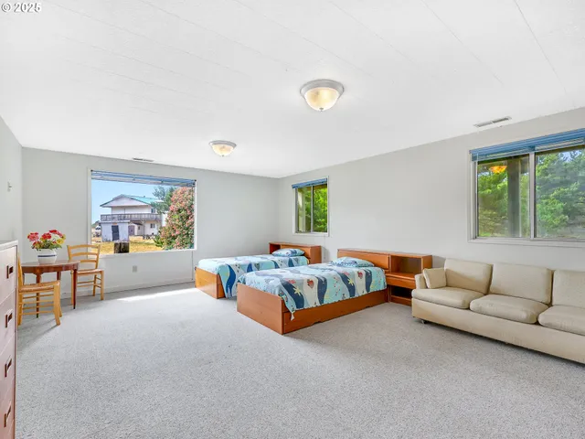 a bedroom with furniture and window