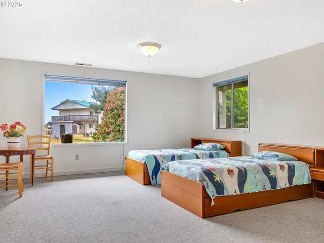 a bedroom with a bed and a table in it