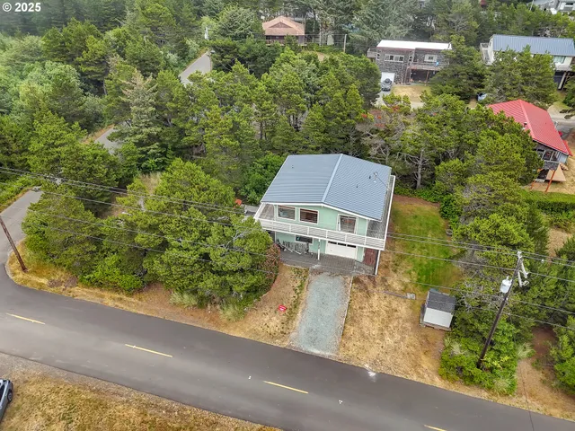 an aerial view of residential house and outdoor space