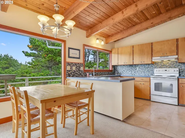 a kitchen with a stove a sink and a microwave
