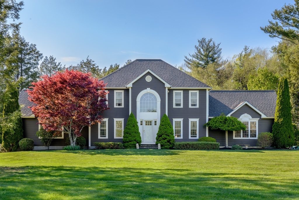 27 Vista Circle Rutland, MA 01543 - Photo 2 of 35 a front view of a house with a garden