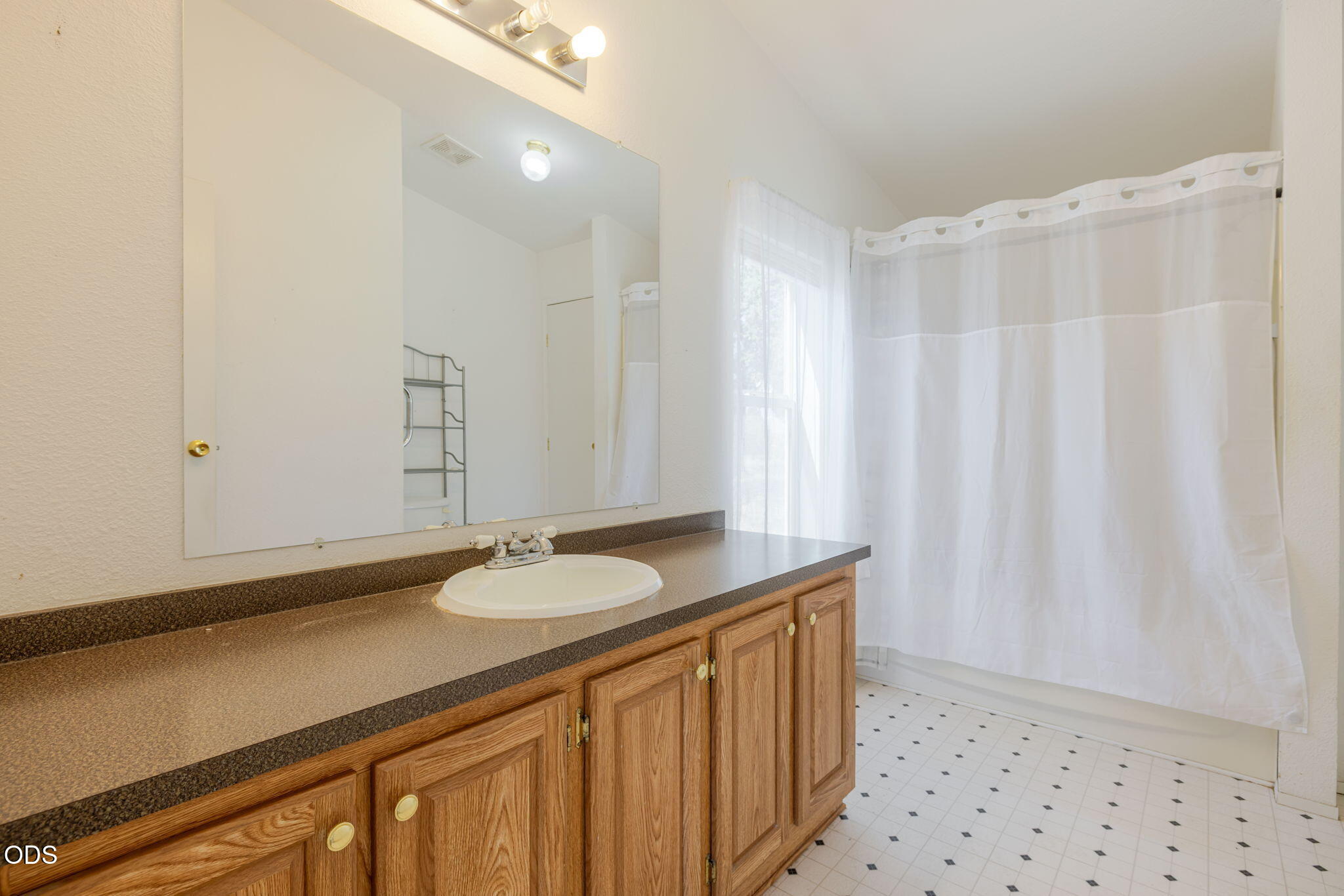 8628 Southwest Crater Loop Road Terrebonne, OR 97760 - Photo 20 of 36 a bathroom with a sink and a mirror