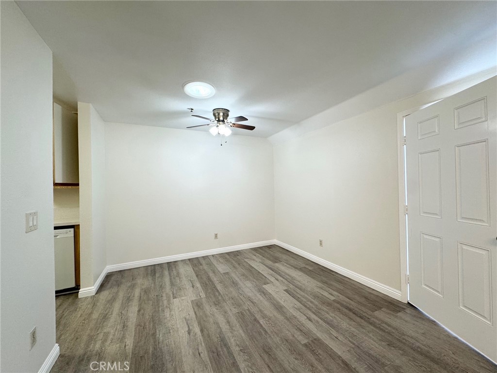 17511 Newland Street, Unit D Huntington Beach, CA 92647 - Photo 5 of 15 wooden floor in an empty room
