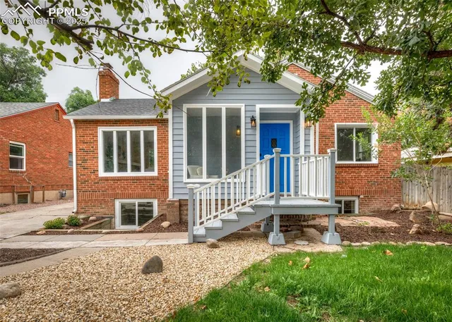 front view of a house with a yard