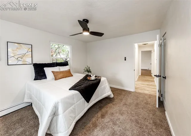 a bedroom with bed and a window