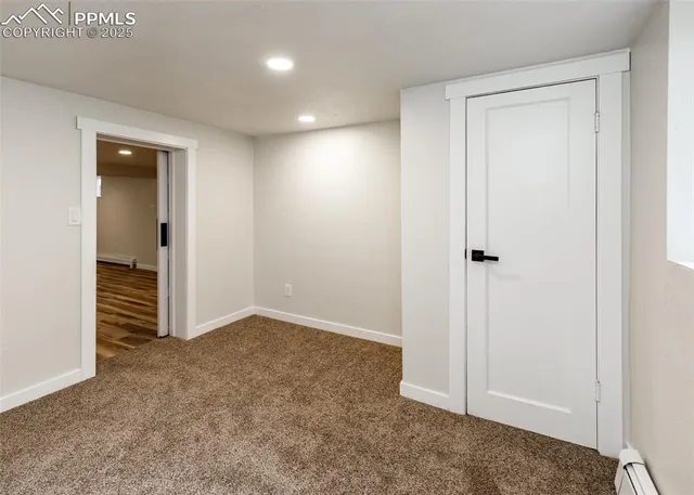 an empty room with closet area