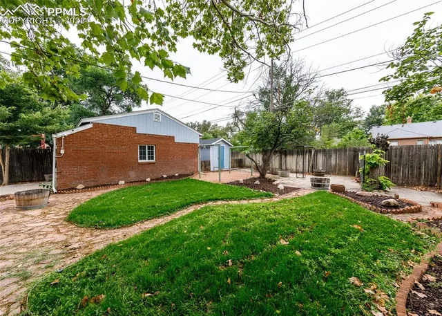 a house view with a sitting space and garden
