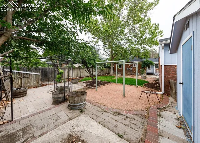 a view of a backyard with sitting area