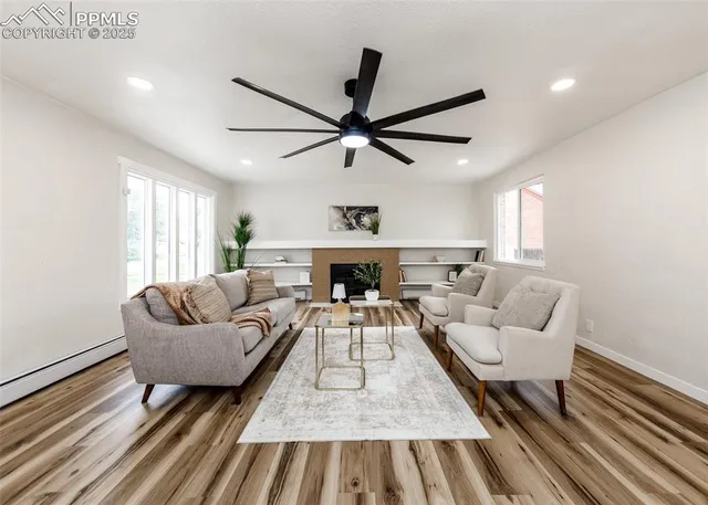a living room with furniture and a fireplace
