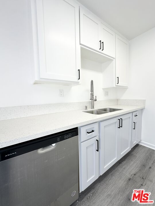 6795 Paramount Boulevard Long Beach, CA 90805 - Photo 1 of 9 a kitchen with a sink and a window