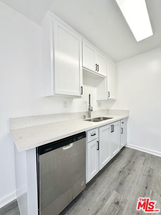 6795 Paramount Boulevard Long Beach, CA 90805 - Photo 2 of 9 a kitchen with stainless steel appliances cabinets and a sink
