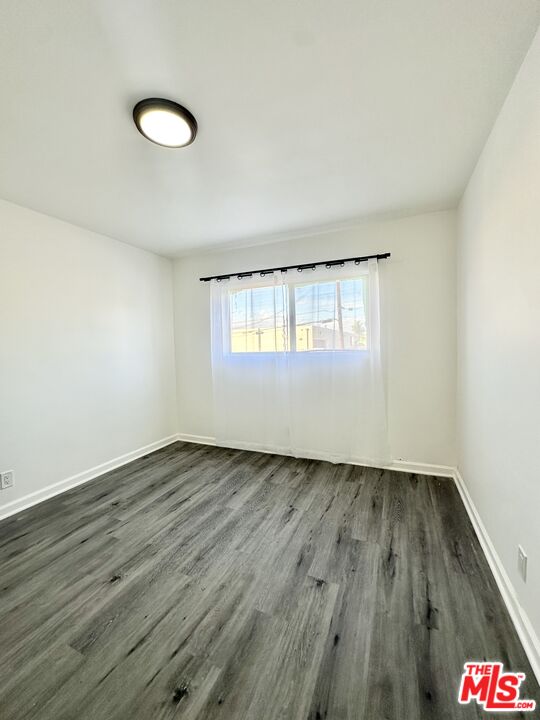 6795 Paramount Boulevard Long Beach, CA 90805 - Photo 7 of 9 a view of an empty room and window
