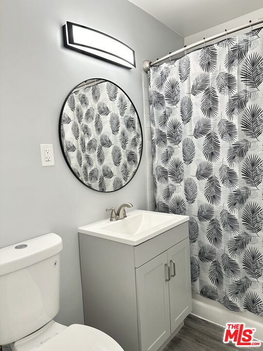 6795 Paramount Boulevard Long Beach, CA 90805 - Photo 9 of 9 a bathroom with a sink and a mirror
