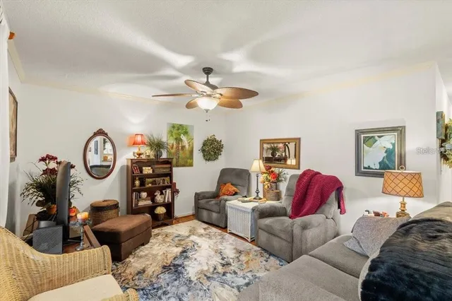 a living room with furniture a rug and a window