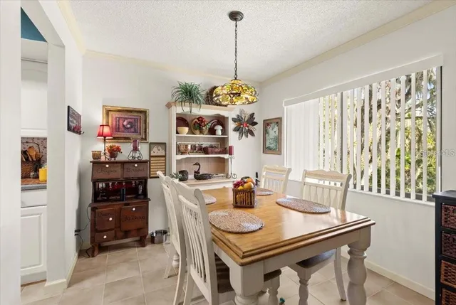 a dining room with furniture and window