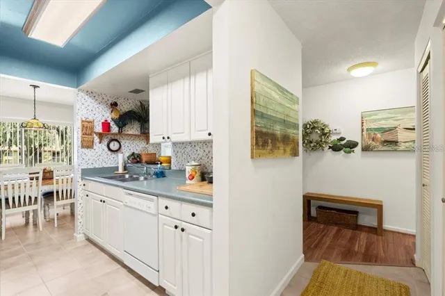 a kitchen with stainless steel appliances granite countertop a sink and cabinets