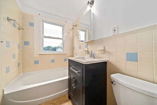 a view of a patio with table and chairs