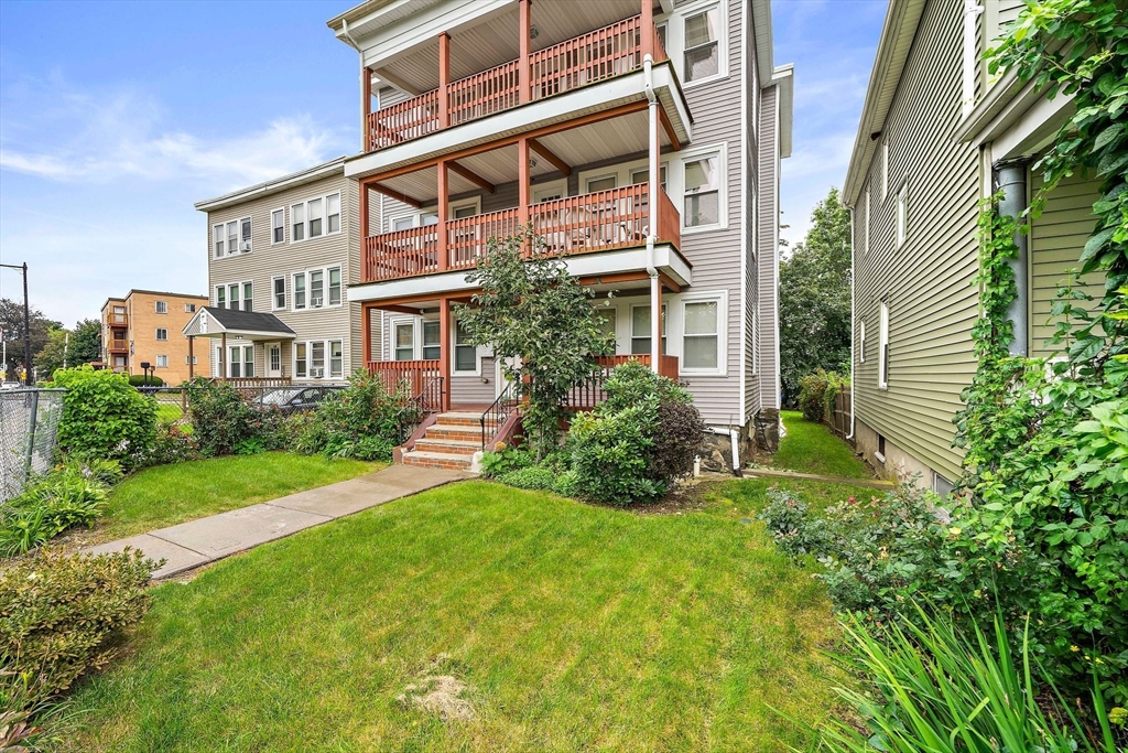 742 River Street, Unit 1 Boston, MA 02136 - Photo 15 of 17 front view of a house with a yard