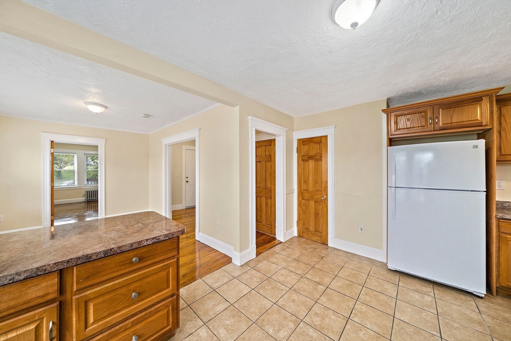 742 River Street, Unit 1 Boston, MA 02136 - Photo 4 of 17 a spacious bathroom with a granite countertop sink and a mirror