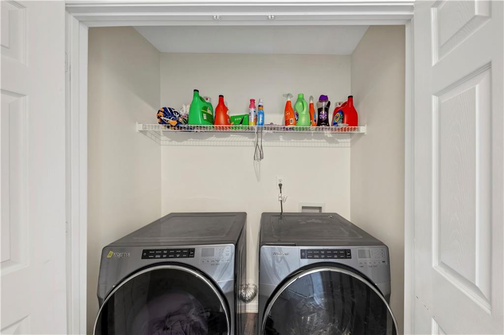 2880 Field Spring Drive Lithonia, GA 30058 - Photo 8 of 31 a utility room with dryer and washer