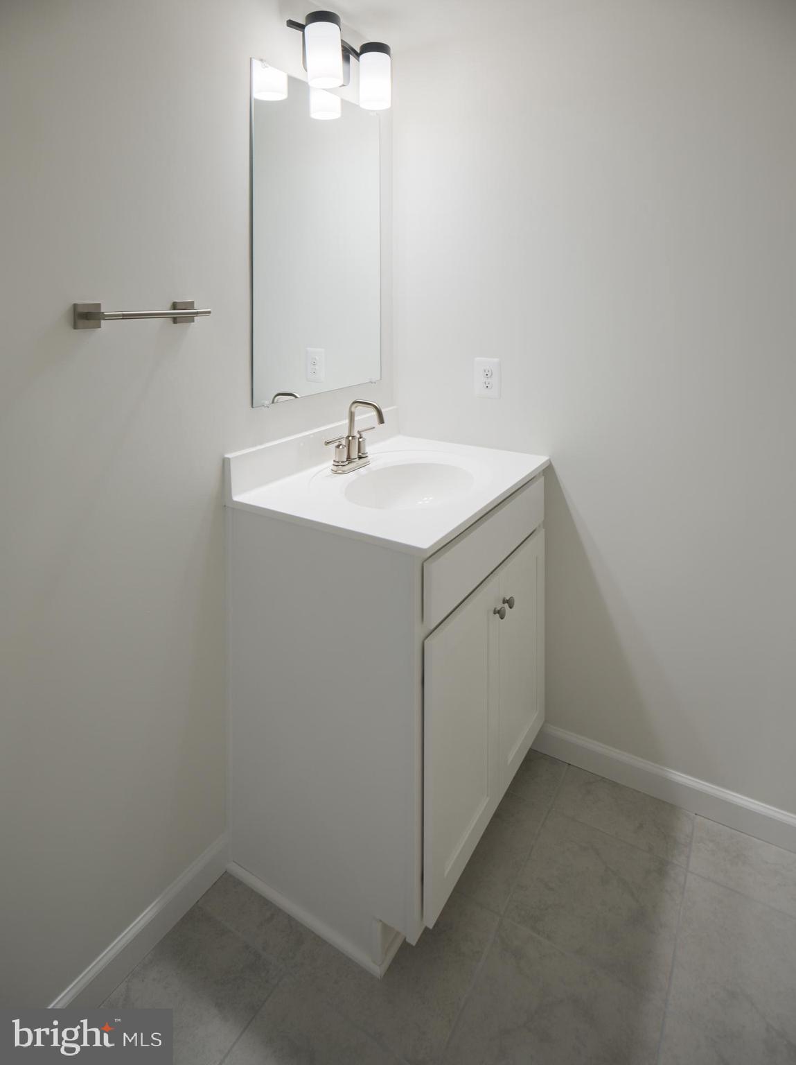 2617 Front Shed Drive Frederick, MD 21702 - Photo 14 of 77 a bathroom with a sink and mirror