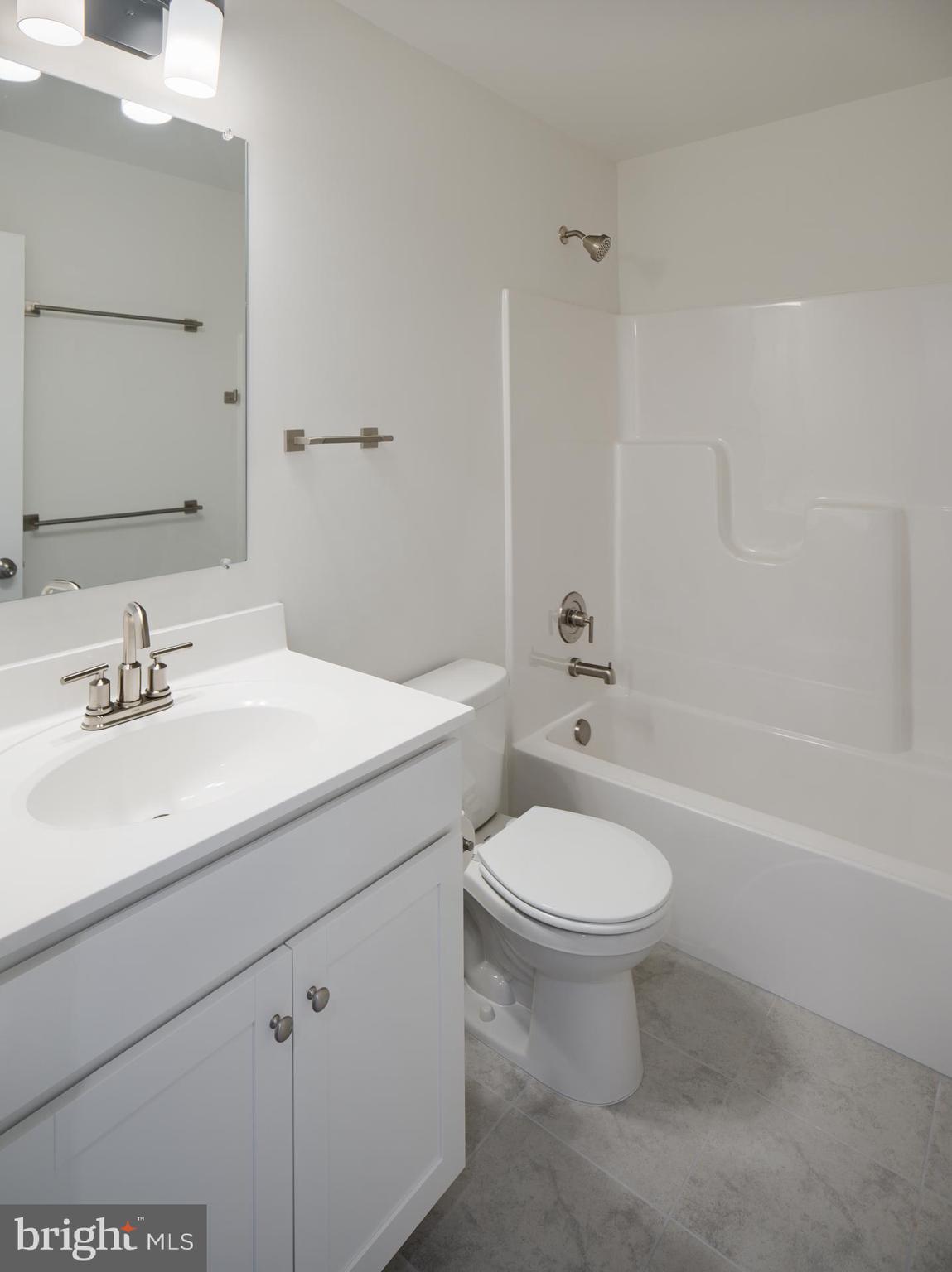 2617 Front Shed Drive Frederick, MD 21702 - Photo 35 of 77 a bathroom with a sink a toilet and a mirror