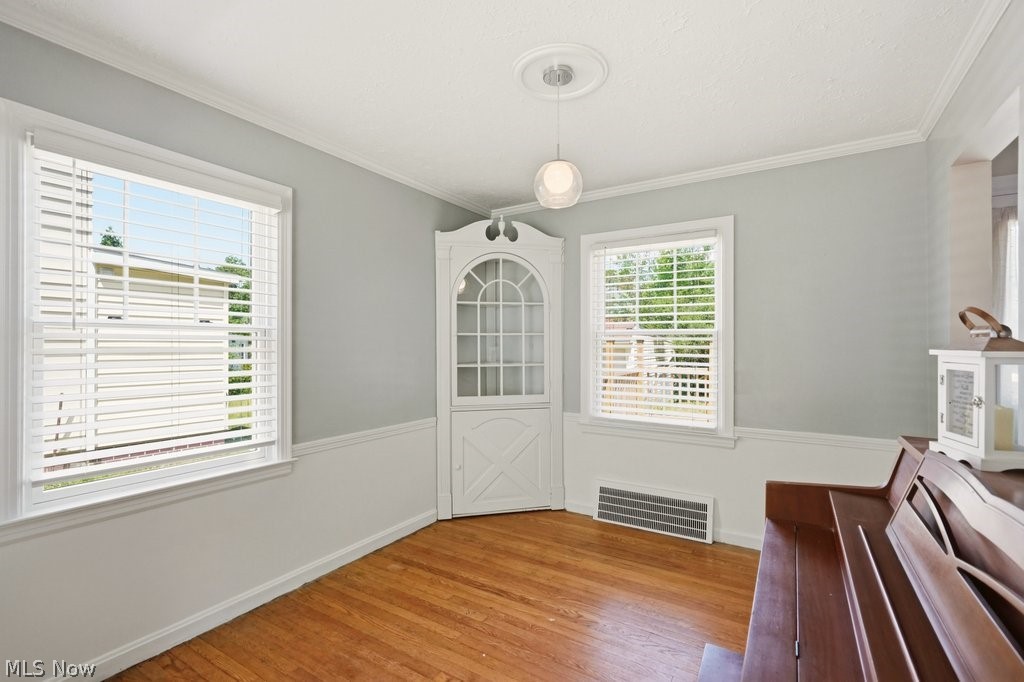 1379 Winston Road South Euclid, OH 44121 - Photo 7 of 30 Dining Room with hardwood floors and built-in china cabinet
