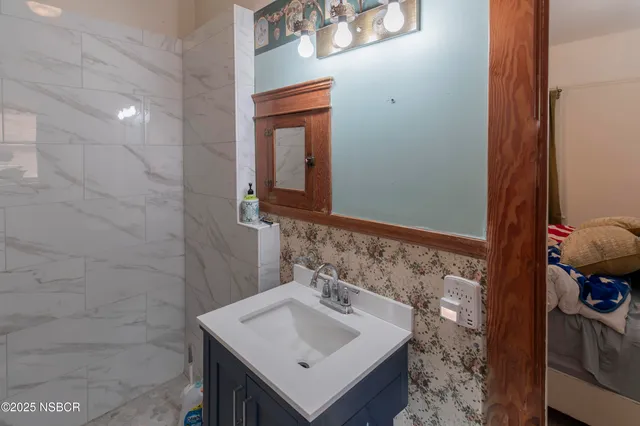 a bathroom with a sink and a mirror