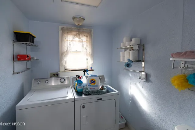 a kitchen with a sink and a stove top oven