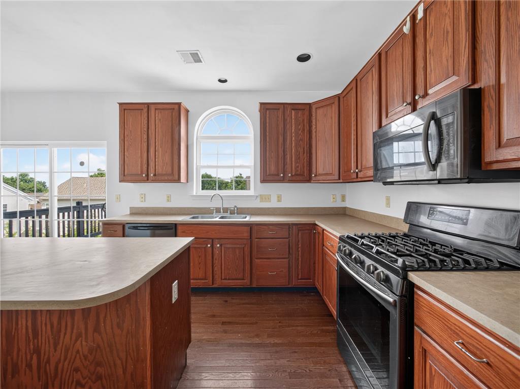 3821 Rittenhouse Road Lower Macungie Township, PA 18062 - Photo 33 of 62 A well-equipped kitchen features rich wood cabinetry, durable countertops, and sleek stainless steel appliances.