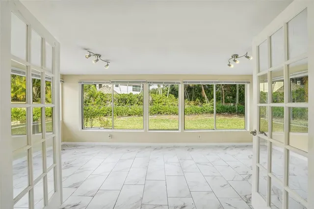 a view of an empty room with a large window