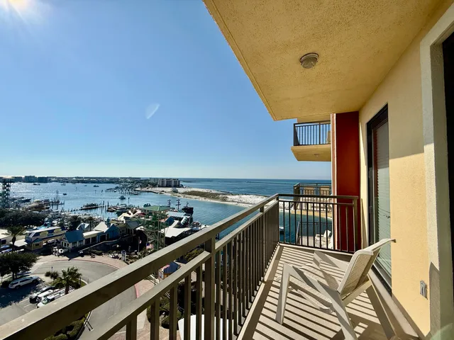 a view of a balcony with chairs