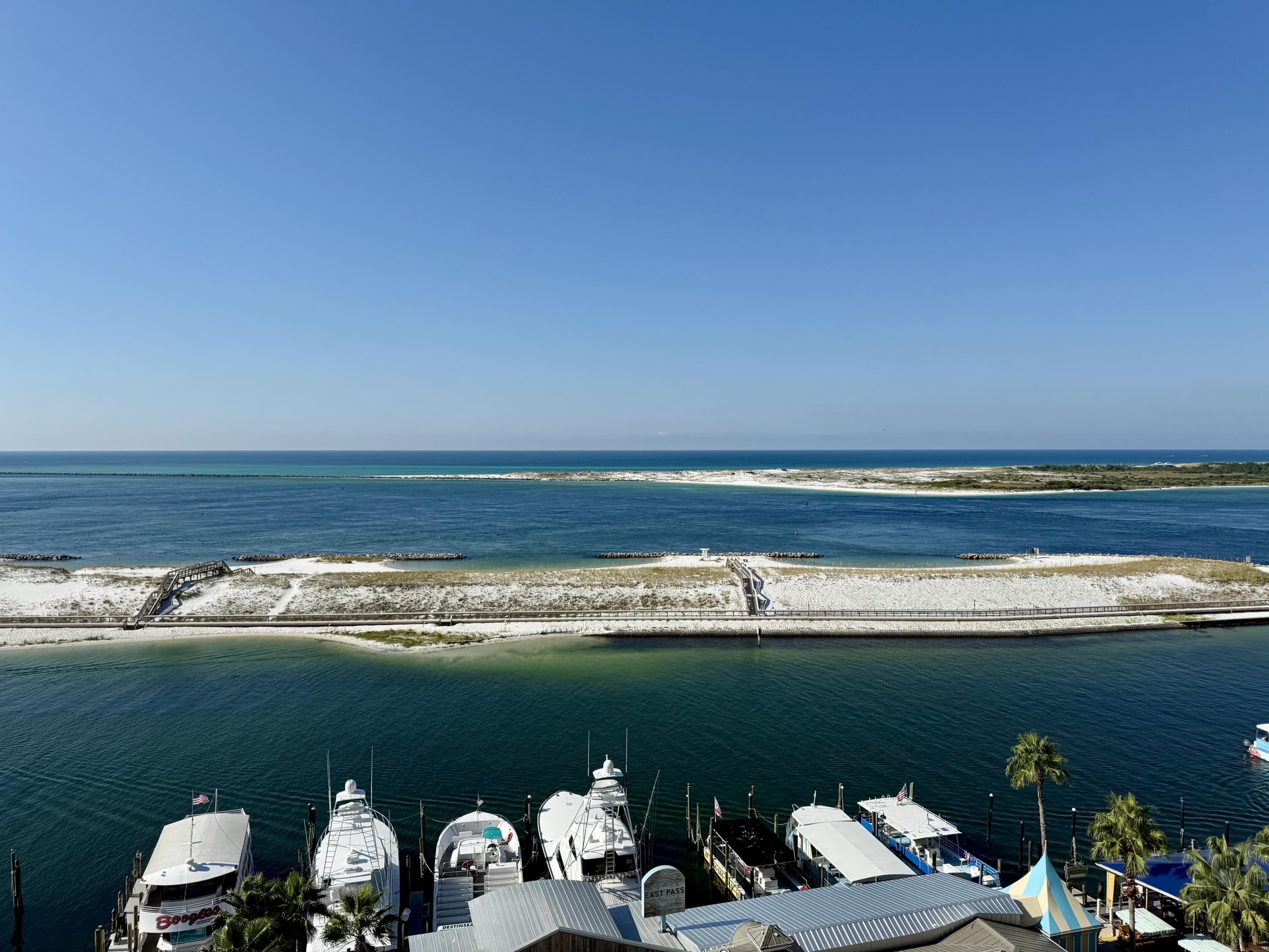 10 Harbor Boulevard, Unit E506F Destin, FL 32541 - Photo 22 of 33 a view of a lake with couches chairs