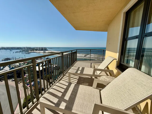 a view of a balcony with chairs