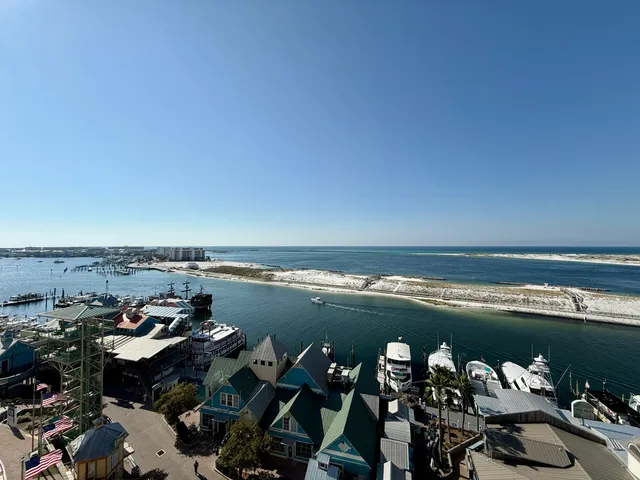 a view of a lake with lawn chairs