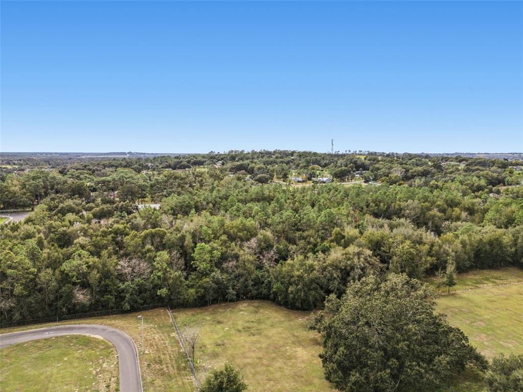 Centennial Road Dade City, FL 33525 - Photo 13 of 21 an aerial view of a residential houses with yard and mountain view in back
