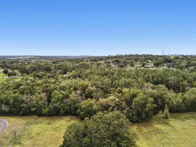 a view of a large body of water with a building in the background