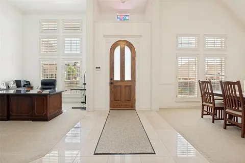 a view of a livingroom with furniture window and wooden floor