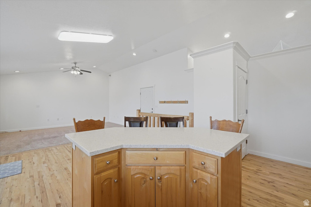 791 East Saddle Road Grantsville, UT 84029 - Photo 10 of 46 Kitchen island with light-toned countertop and wood cabinetry