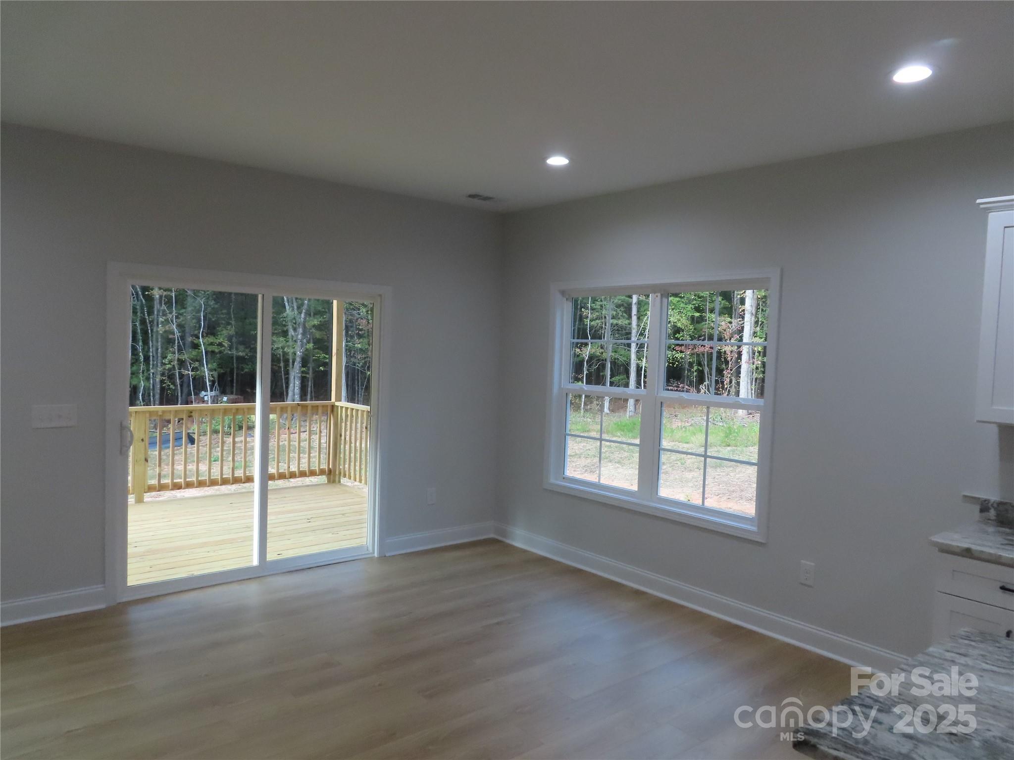 2099 Cedar Road York, SC 29745 - Photo 14 of 37 a view of an empty room with wooden floor and a window