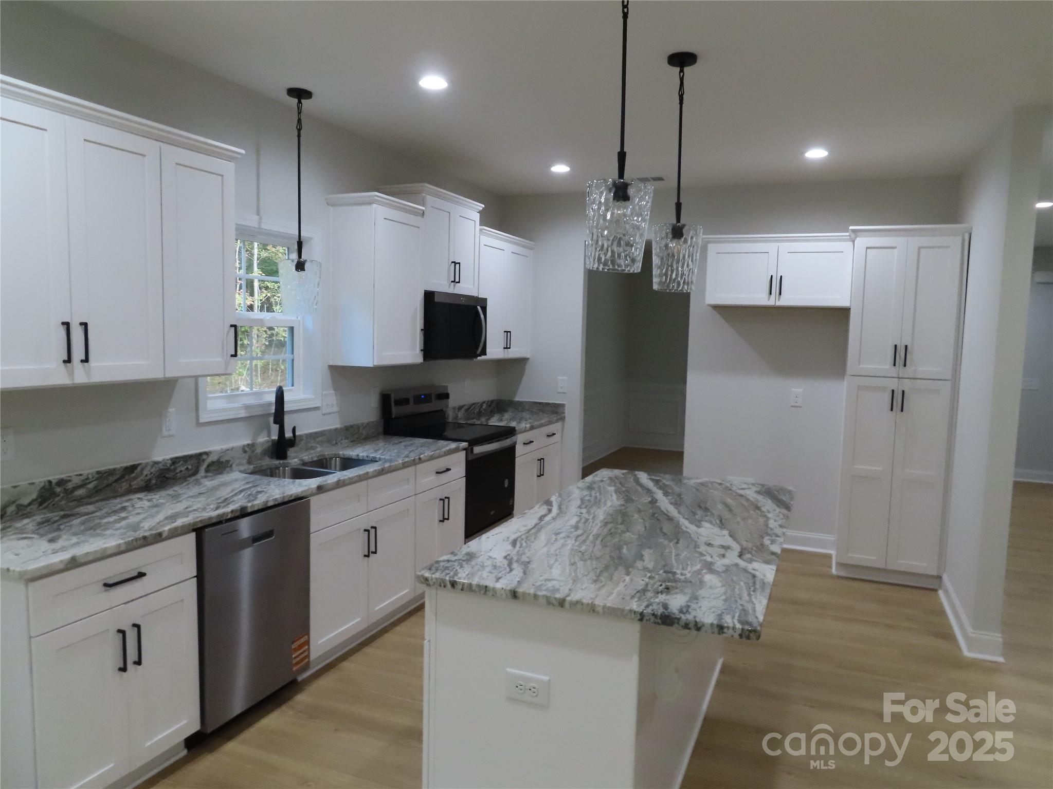 2099 Cedar Road York, SC 29745 - Photo 16 of 37 a kitchen with a sink stove and refrigerator