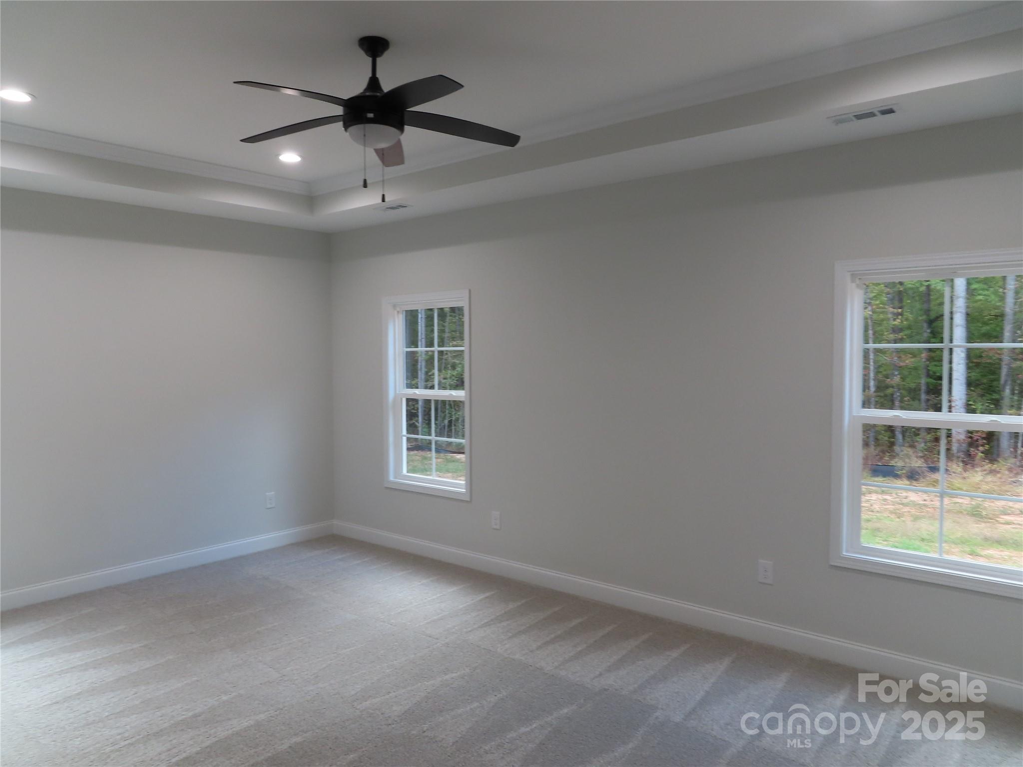 2099 Cedar Road York, SC 29745 - Photo 17 of 37 an empty room with a window and a ceiling fan