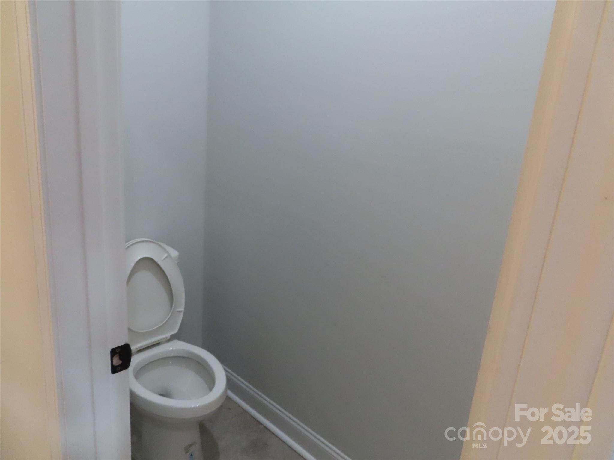 2099 Cedar Road York, SC 29745 - Photo 20 of 37 a bathroom with a granite countertop toilet and a sink
