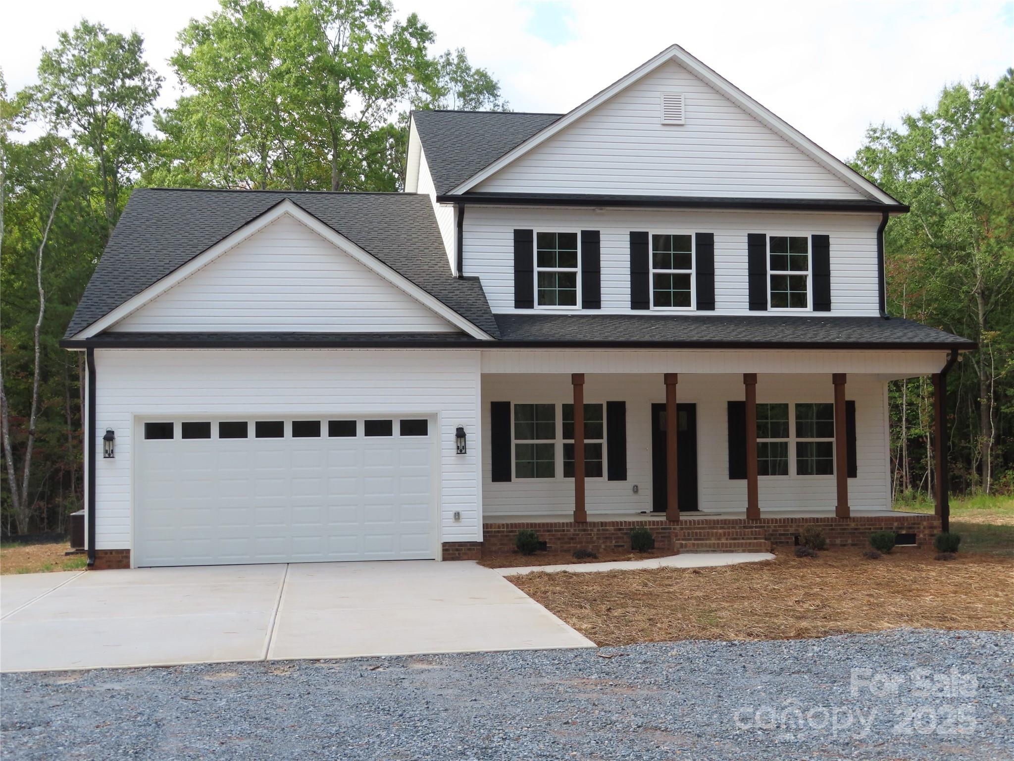 2099 Cedar Road York, SC 29745 - Photo 2 of 37 a front view of a house with a yard and garage