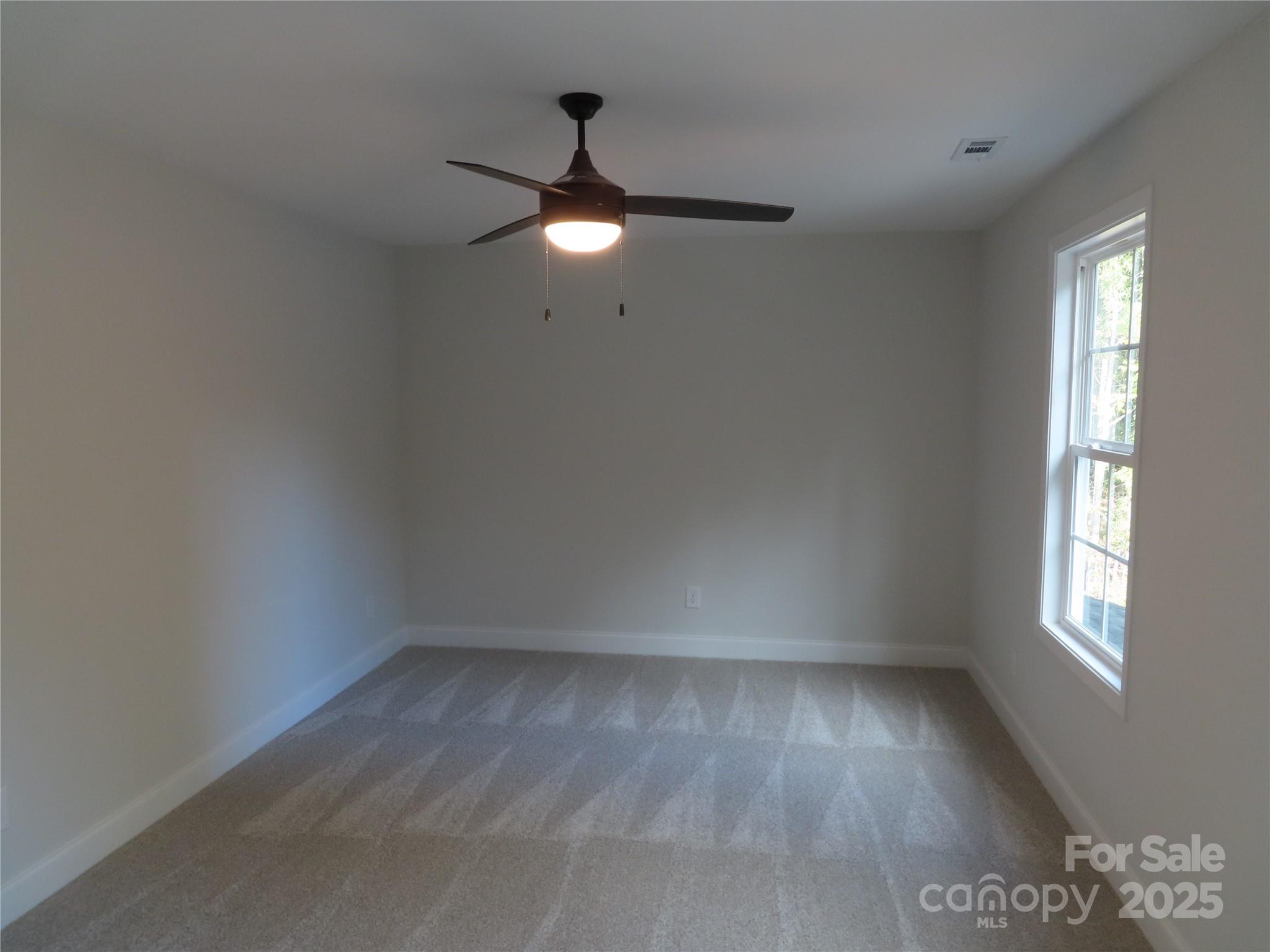 2099 Cedar Road York, SC 29745 - Photo 35 of 37 wooden floor in an empty room with a window