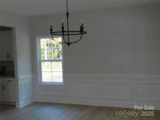 a empty room with a window and a ceiling fan