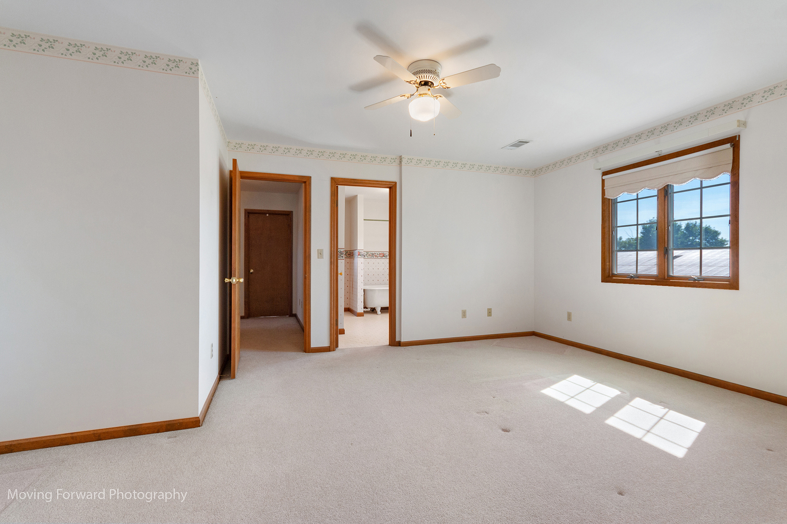 1645 East Southmor Road Morris, IL 60450 - Photo 21 of 39 an empty room with chandelier fan and windows