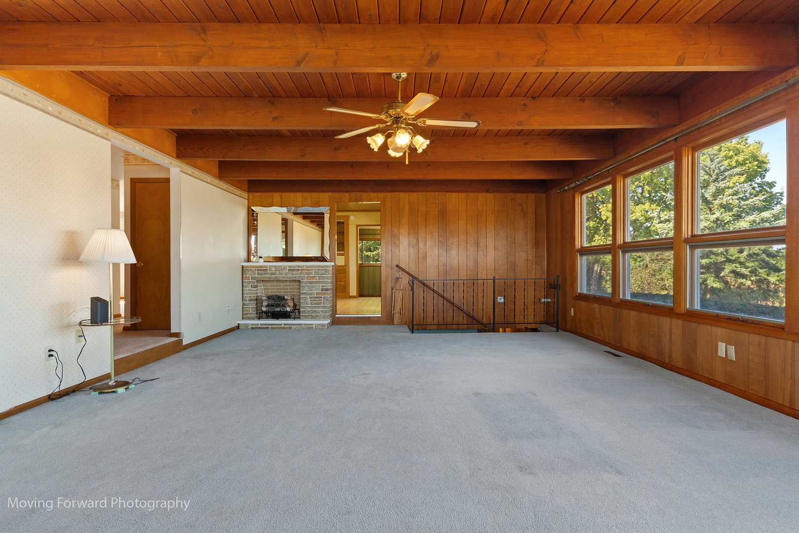 1645 East Southmor Road Morris, IL 60450 - Photo 5 of 39 an empty room with chandelier fan windows and fireplace