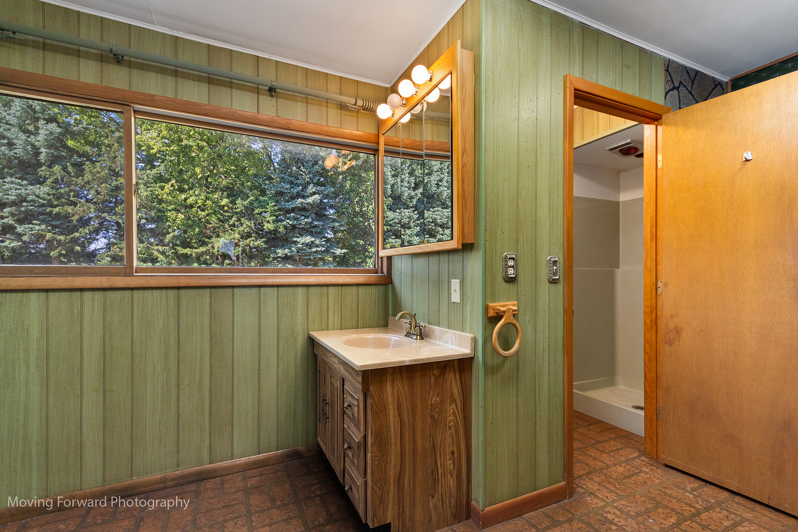 1645 East Southmor Road Morris, IL 60450 - Photo 10 of 39 a bathroom with a sink a mirror and a window