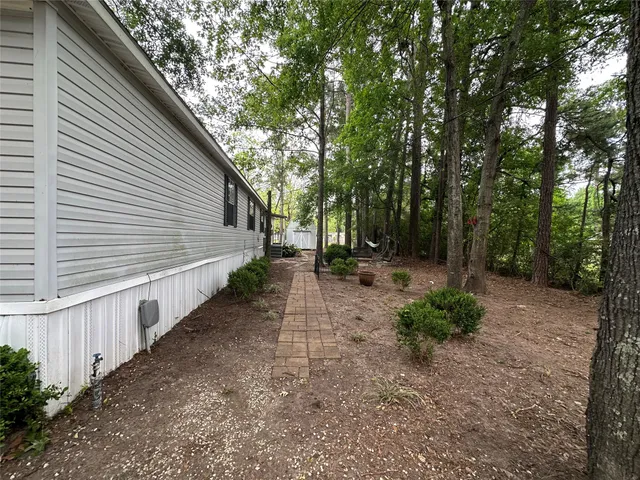 a view of backyard with green space
